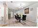 Modern dining room featuring a glass table and views of the open kitchen at 1204 Pleasant Pl, Lakeland, FL 33801