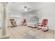 Bright living room featuring tile flooring, fresh paint, and modern ceiling fan at 1204 Pleasant Pl, Lakeland, FL 33801