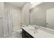 Bright bathroom featuring a shower-tub combo and vanity with modern fixtures at 1370 Kiawah St, Celebration, FL 34747