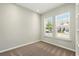 Bedroom has two windows with views of the neighborhood at 1370 Kiawah St, Celebration, FL 34747