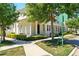 Beautiful townhouse with lovely landscaping and mature trees surrounding the property at 1370 Kiawah St, Celebration, FL 34747