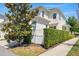 Exterior view of the property showing the yard, garden hedge, and landscaping at 1370 Kiawah St, Celebration, FL 34747