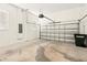 An empty two car garage with concrete flooring and a white concrete block wall at 1370 Kiawah St, Celebration, FL 34747