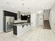 Spacious kitchen with granite countertops, stainless appliances and center island at 1370 Kiawah St, Celebration, FL 34747