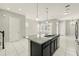 Open kitchen with granite countertops and stainless appliances overlooks a large breakfast nook at 1370 Kiawah St, Celebration, FL 34747
