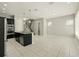 Open floor plan living room adjacent to kitchen and stairs at 1370 Kiawah St, Celebration, FL 34747