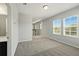 Bright loft space with large windows, neutral carpet, and access to bathroom and hallway at 1370 Kiawah St, Celebration, FL 34747