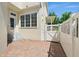 Brick-paved patio featuring gated access, staircase, and building exterior at 1370 Kiawah St, Celebration, FL 34747