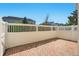 A brick paved patio with a white fence and landscaped backyard beyond at 1370 Kiawah St, Celebration, FL 34747