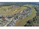 Beautiful aerial view of a golf course community featuring manicured greens, mature trees, and luxurious single-Gathering homes at 1821 N Hampton Dr, Davenport, FL 33897