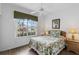 Bright bedroom with large window offering neighborhood views and a cozy ambiance at 1821 N Hampton Dr, Davenport, FL 33897