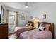 Charming bedroom with two beds decorated with themed decor at 1821 N Hampton Dr, Davenport, FL 33897