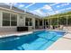 Gorgeous screened pool with spa and spacious deck, perfect for outdoor enjoyment at 1821 N Hampton Dr, Davenport, FL 33897