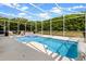 Screened-in pool and hot tub area with lounge chairs for a relaxing outdoor experience at 1821 N Hampton Dr, Davenport, FL 33897