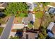 An aerial view of a single-Gathering home featuring a long driveway and mature trees in a well-manicured lawn at 201 La Paz Dr, Kissimmee, FL 34743