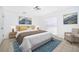 Cozy bedroom features neutral walls, tile floor, and two mountain landscape artworks at 201 La Paz Dr, Kissimmee, FL 34743