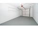 Spacious one car garage with epoxy floor and overhead storage racks at 201 La Paz Dr, Kissimmee, FL 34743