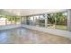 Bright sunroom with tile floors and large windows offering a view of the backyard at 201 La Paz Dr, Kissimmee, FL 34743
