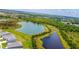 Aerial view of homes near bodies of water and a green landscape at 2705 Grandbury Grove Rd, Lakeland, FL 33811
