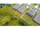 This aerial shows well maintained lawns and dark gray roofs at 2705 Grandbury Grove Rd, Lakeland, FL 33811