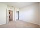 Bright bedroom with neutral carpet and doors to bathroom and closet at 2705 Grandbury Grove Rd, Lakeland, FL 33811
