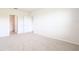 Spacious bedroom with neutral carpet and multiple doors at 2705 Grandbury Grove Rd, Lakeland, FL 33811