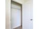 Walk-in closet with a wire rack shelf and neutral colored carpeting at 2705 Grandbury Grove Rd, Lakeland, FL 33811
