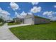 Well-maintained home featuring a green lawn, two-car garage, and inviting curb appeal at 2705 Grandbury Grove Rd, Lakeland, FL 33811
