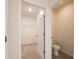 Hallway features a walk-in closet and a small bathroom with toilet at 2705 Grandbury Grove Rd, Lakeland, FL 33811
