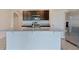 Bright kitchen with stainless steel appliances and granite countertops on a center island at 2705 Grandbury Grove Rd, Lakeland, FL 33811