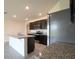 Kitchen with stainless steel appliances, granite counters, and large center island at 2705 Grandbury Grove Rd, Lakeland, FL 33811