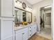 Bathroom features a double vanity and a glass shower with a tile surround, and a walk in closet at 2748 Greenlands St, St Cloud, FL 34772