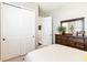 Bright bedroom with a closet, dresser, and decor, offering ample storage and a touch of elegance at 2748 Greenlands St, St Cloud, FL 34772