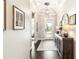 Elegant entryway with dark wood floors, decorative console table, and stylish light fixture at 2748 Greenlands St, St Cloud, FL 34772