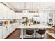 Beautiful kitchen with white cabinets, stainless appliances, pendant lighting, and a center island at 2748 Greenlands St, St Cloud, FL 34772