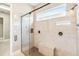 Modern glass enclosed shower with tile surround, and a built in bench at 2748 Greenlands St, St Cloud, FL 34772