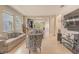 Open floor plan features a spacious living room with tile flooring and views into the kitchen at 2820 Avian Loop, Kissimmee, FL 34741