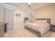 Large main bedroom features tile flooring, tray ceilings, and a spacious layout at 2820 Avian Loop, Kissimmee, FL 34741