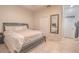 Main bedroom featuring neutral walls, tile floors, and ensuite bathroom access at 2820 Avian Loop, Kissimmee, FL 34741