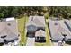 An aerial view showcasing the property's layout, solar panels, landscaping, and location within the community at 3038 Camden Way, Davenport, FL 33837