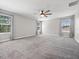 Spacious bedroom with a ceiling fan and carpeted flooring with plenty of natural light at 3038 Camden Way, Davenport, FL 33837