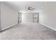 Large, open bedroom featuring a ceiling fan, neutral carpet and plenty of light at 3038 Camden Way, Davenport, FL 33837
