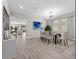 Dining room area with modern chandelier, decor, and six-chair dining set at 3038 Camden Way, Davenport, FL 33837
