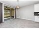 Dining room featuring tile floors, sliding glass door, and modern lighting fixture at 3038 Camden Way, Davenport, FL 33837