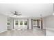 Spacious living area with tile flooring, lots of natural light, and a ceiling fan at 3038 Camden Way, Davenport, FL 33837