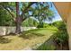 Expansive backyard featuring mature trees and lush greenery, creating a serene outdoor retreat at 3075 Simpson Rd, Kissimmee, FL 34744