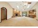 Bright and spacious living room with brick fireplace, skylights, ceiling fans, and access to backyard at 3075 Simpson Rd, Kissimmee, FL 34744