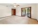 Spacious bedroom with fan, neutral color palette and access to private porch at 3075 Simpson Rd, Kissimmee, FL 34744