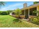 Relaxing screened patio with brick accents, providing a comfortable outdoor living space at 3075 Simpson Rd, Kissimmee, FL 34744