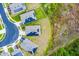 Aerial view of modern homes with solar panels in a well-maintained community with cul-de-sac at 3161 Royal Tern Dr, Winter Haven, FL 33881